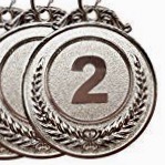 A set of three medals with the number two on them.