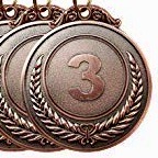 A set of three medals with the number 3 on them.