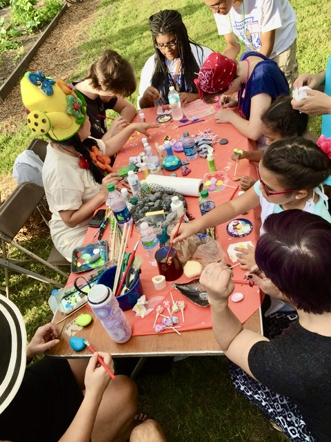 A group of people sitting around a table.